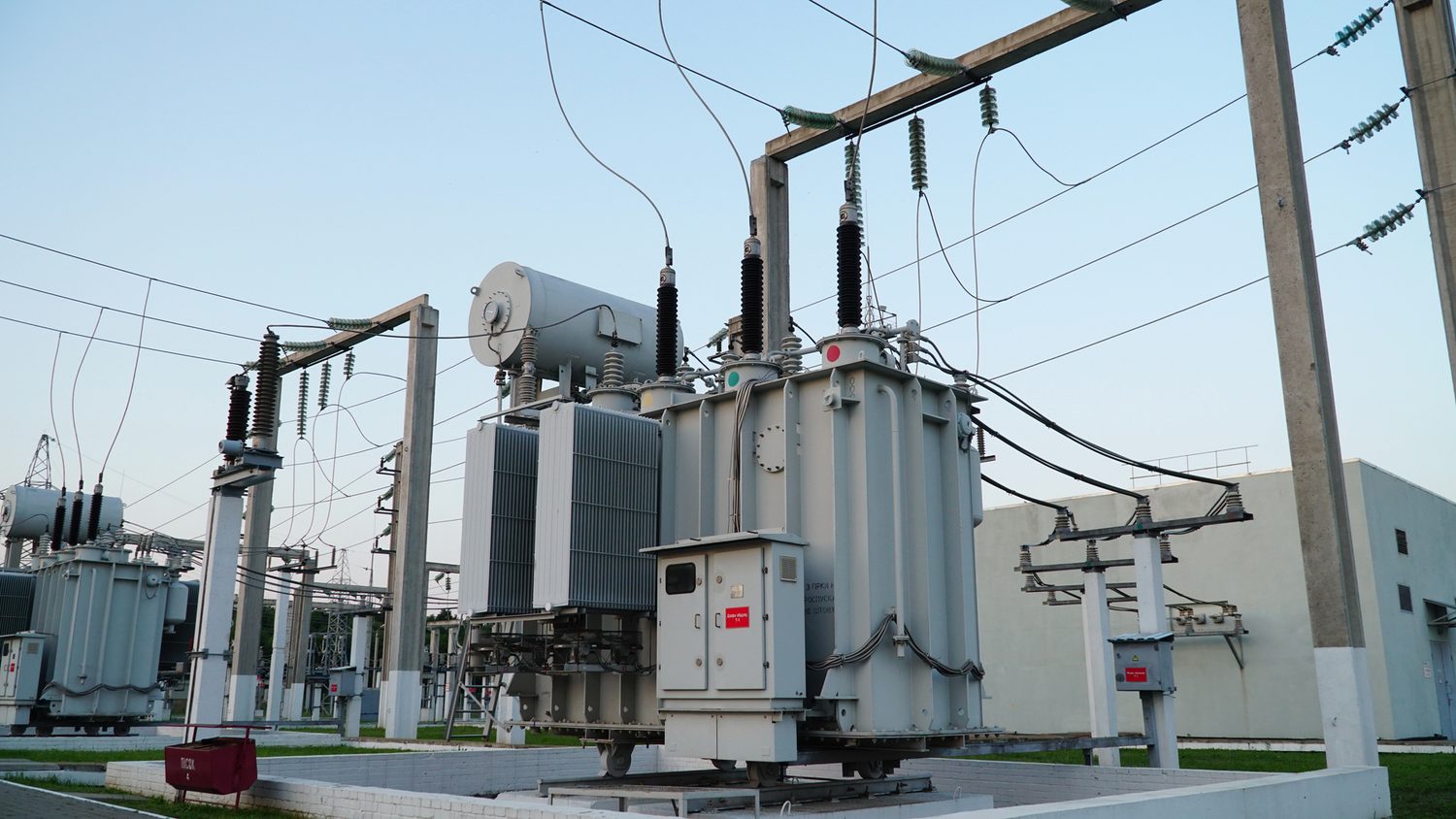 Transformers and insulators at an electrical substation