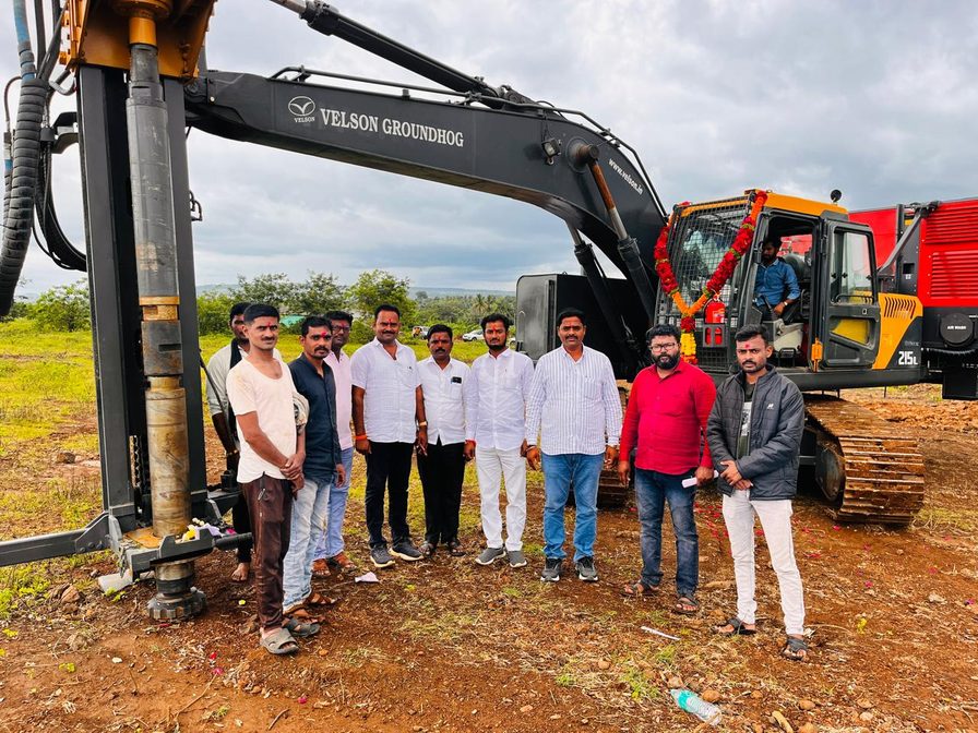 The Sai Infra Services team standing beside a piling rig